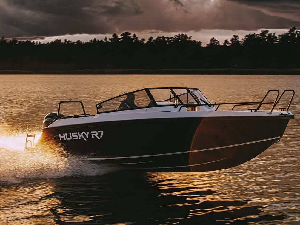 Thumbnail of http://Image%20of%20a%20Husky%20R7%20boat%20on%20the%20water%20with%20a%20classic%20Nordic%20design%20and%20ample%20seating%20space.