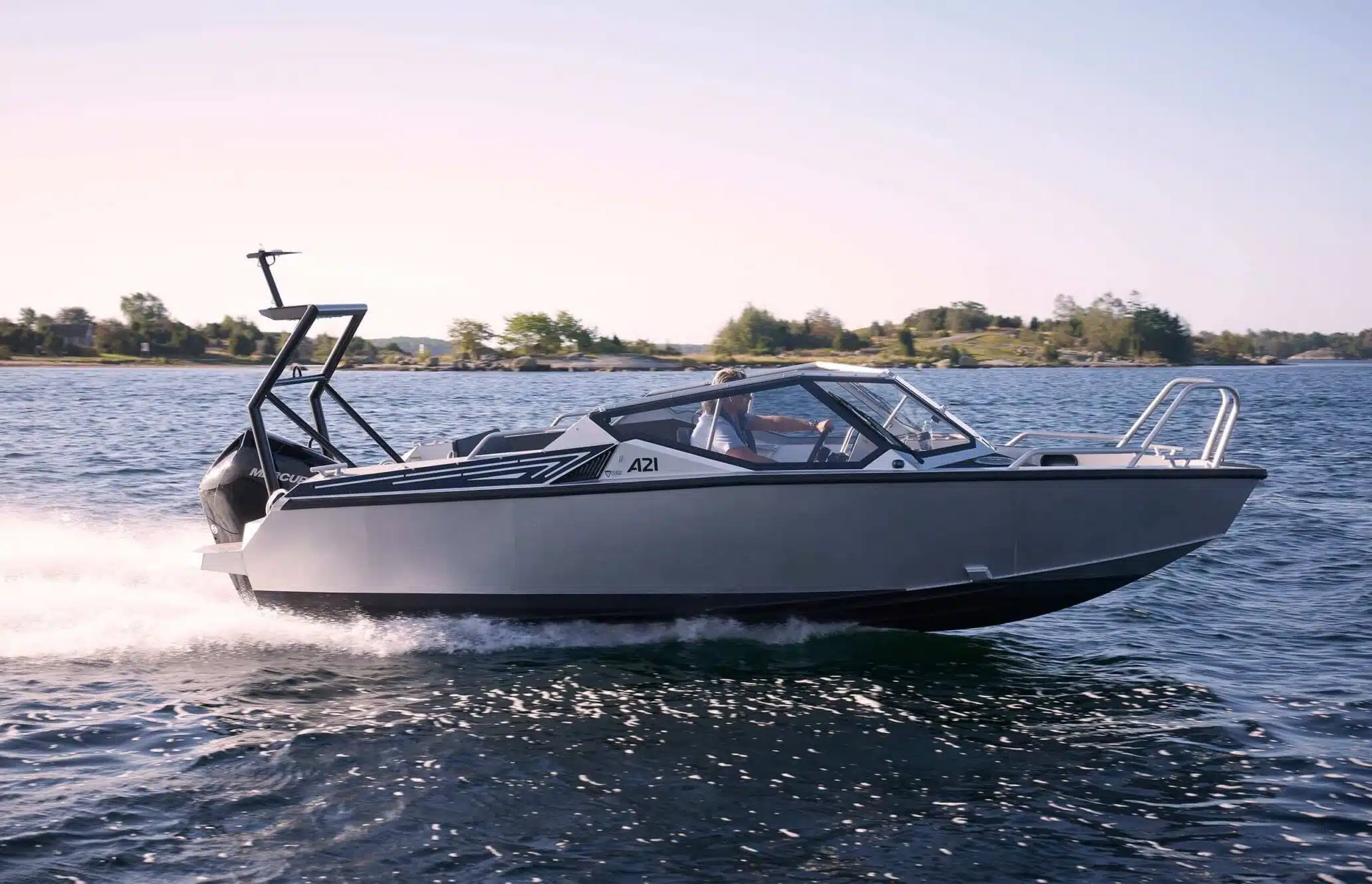 Image of Anytec A21 boat on the water, showcasing its rugged and durable design, with a high-performance engine and advanced technology for an exhilarating ride.